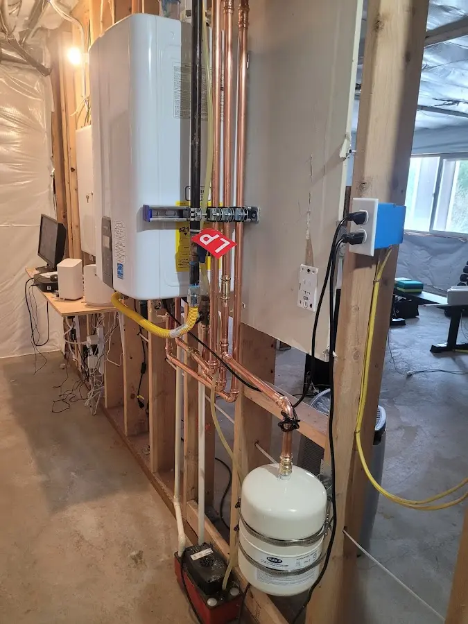 Licensed plumber repairing a kitchen sink in Maplewood